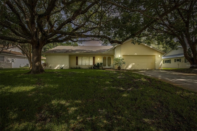 ranch-style house with a front yard and a garage