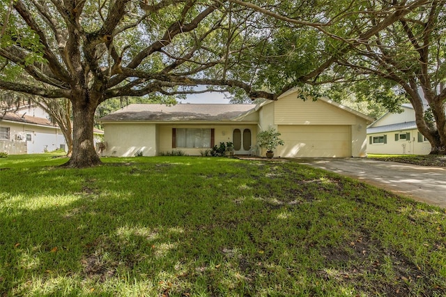 ranch-style house featuring a garage and a front lawn