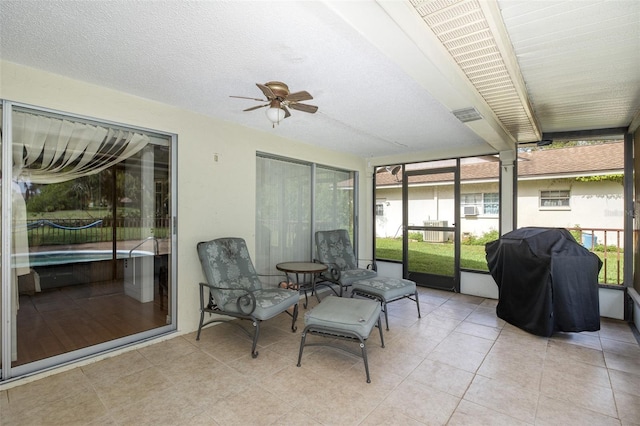 sunroom / solarium with ceiling fan