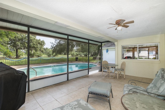 view of swimming pool featuring ceiling fan