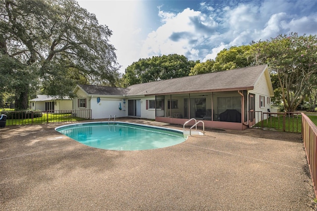 view of swimming pool featuring a patio area