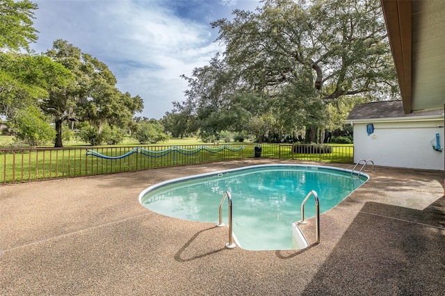 view of swimming pool with a patio area