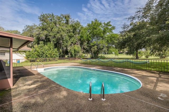 view of swimming pool with a patio