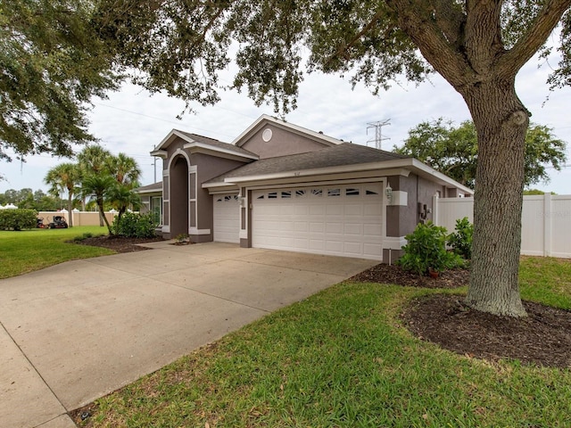 view of front facade with a garage and a front yard