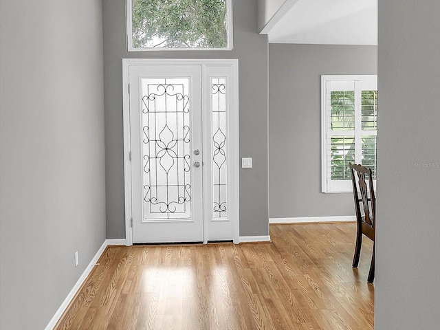 foyer with light hardwood / wood-style floors