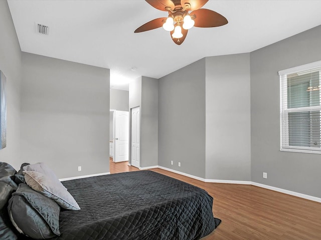 bedroom featuring light hardwood / wood-style floors and ceiling fan