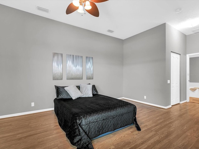 bedroom with ceiling fan and hardwood / wood-style flooring