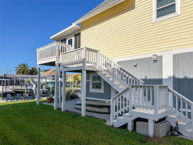 exterior space with a deck and a lawn