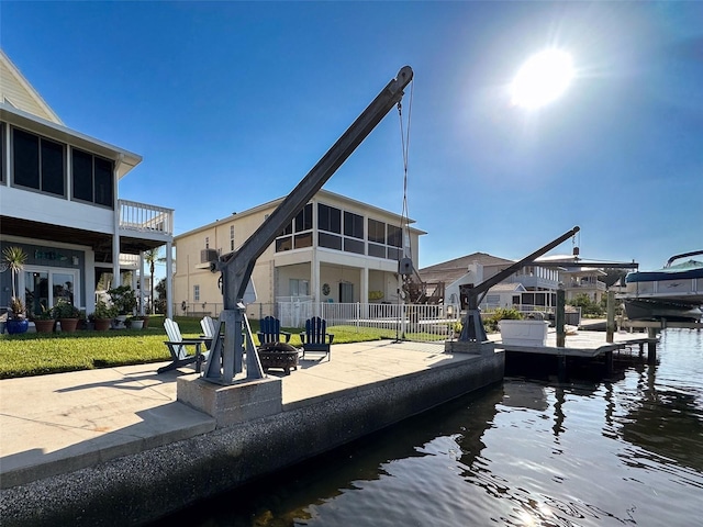 rear view of property with a patio and a water view