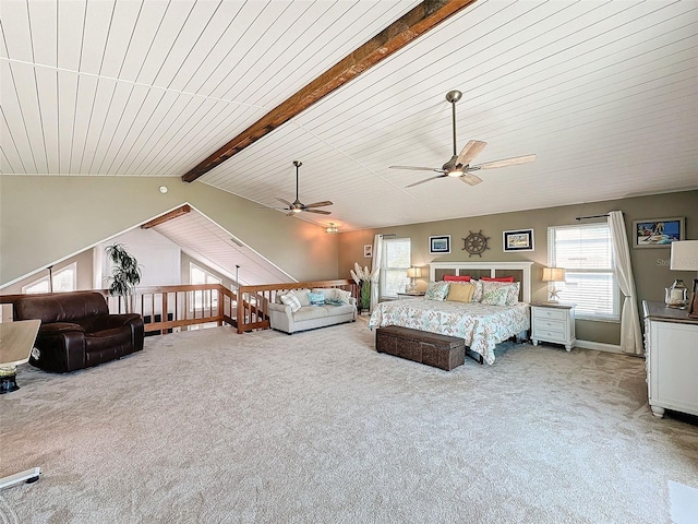 bedroom with vaulted ceiling with beams and light colored carpet