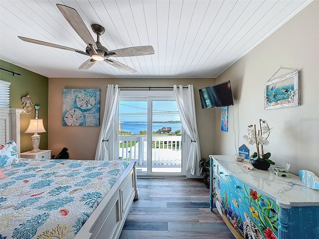 bedroom featuring ceiling fan, access to outside, wood ceiling, and dark hardwood / wood-style flooring