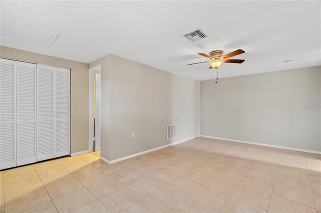 unfurnished bedroom with ceiling fan and light tile patterned floors