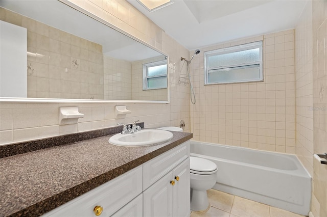 full bathroom featuring tasteful backsplash, tile patterned flooring, toilet, tile walls, and tiled shower / bath