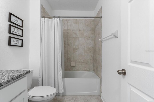 full bathroom featuring tile patterned floors, vanity, toilet, and shower / bath combo