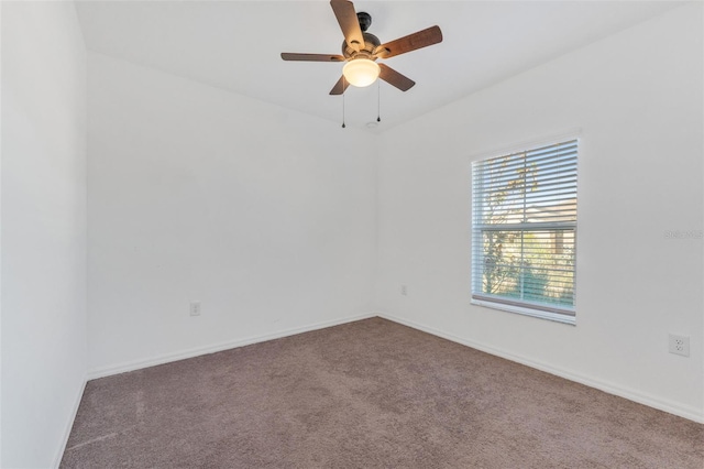 empty room featuring ceiling fan and carpet flooring