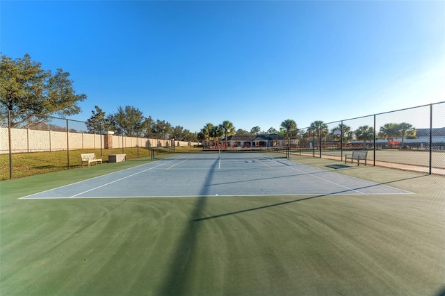 view of tennis court featuring basketball court