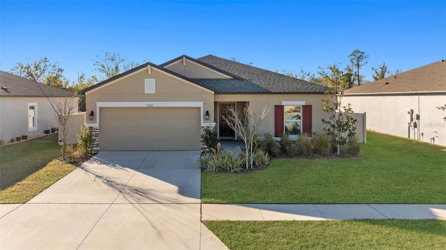 single story home featuring a garage and a front yard