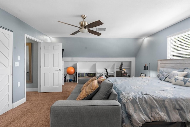 bedroom featuring lofted ceiling, ceiling fan, and carpet