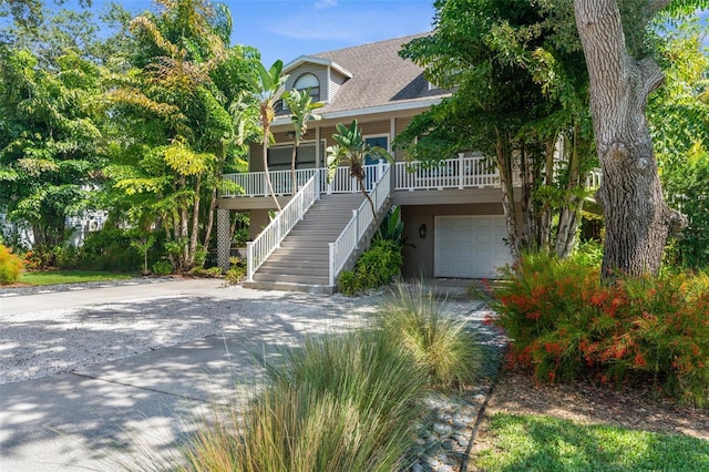 view of front of property with a garage and a porch