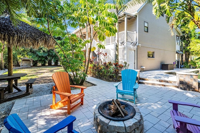 view of patio / terrace with an outdoor fire pit