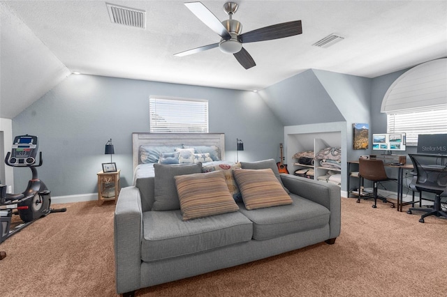 carpeted bedroom featuring vaulted ceiling, a textured ceiling, and ceiling fan