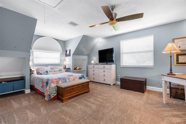 bedroom featuring ceiling fan, carpet flooring, and a textured ceiling