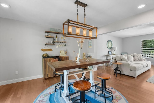 dining area with hardwood / wood-style flooring