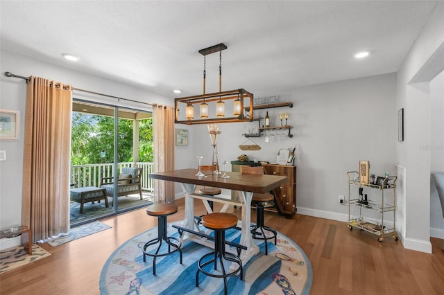 dining room with dark wood-type flooring