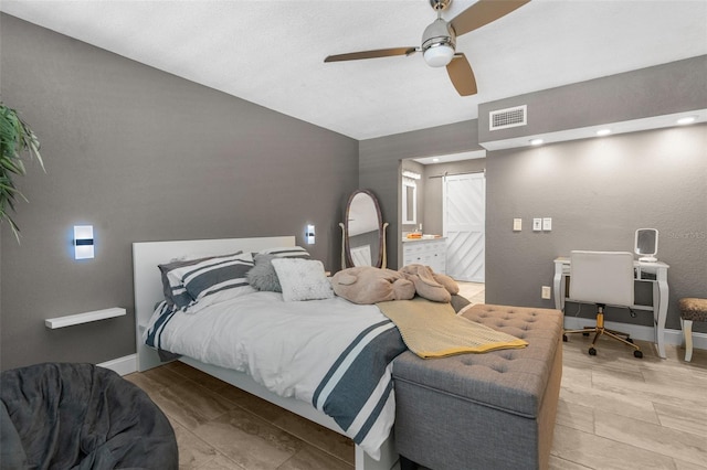 bedroom with connected bathroom and ceiling fan