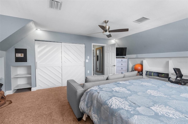 carpeted bedroom featuring vaulted ceiling, ceiling fan, and a closet