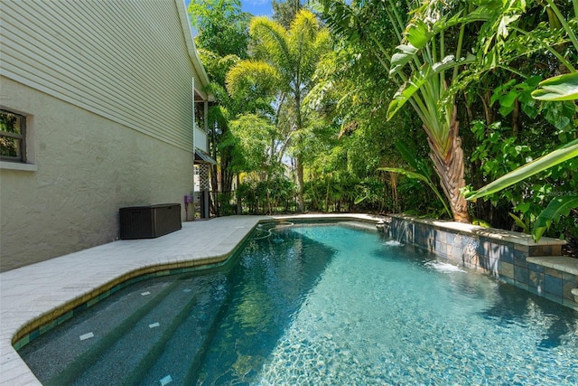 view of pool with pool water feature