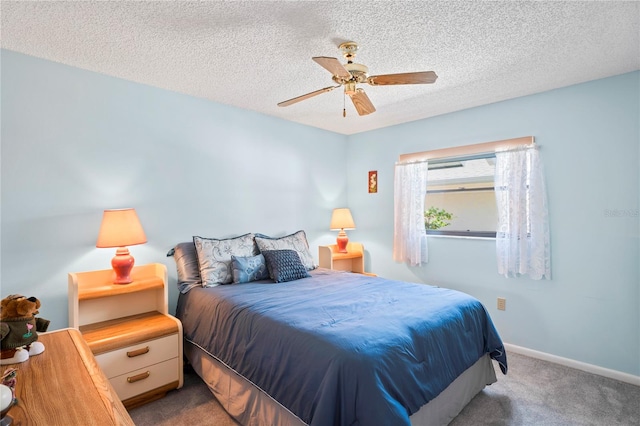 carpeted bedroom with a textured ceiling and ceiling fan