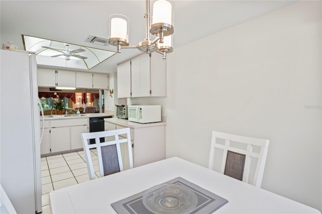 kitchen featuring ceiling fan with notable chandelier, decorative light fixtures, white cabinetry, light tile patterned floors, and white appliances