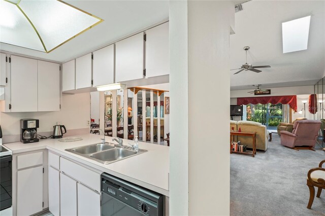 kitchen featuring white cabinetry, carpet floors, ceiling fan, black dishwasher, and sink