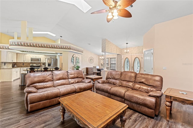 living room featuring dark hardwood / wood-style flooring, ceiling fan, and lofted ceiling