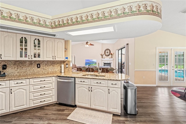 kitchen with dishwasher, french doors, sink, ceiling fan, and kitchen peninsula