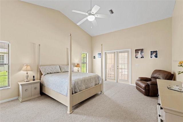 carpeted bedroom with access to outside, vaulted ceiling, and ceiling fan