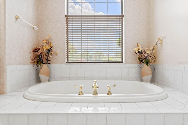 bathroom with tiled tub