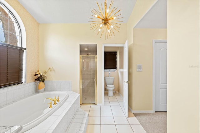 bathroom featuring tile patterned floors, a chandelier, shower with separate bathtub, and toilet