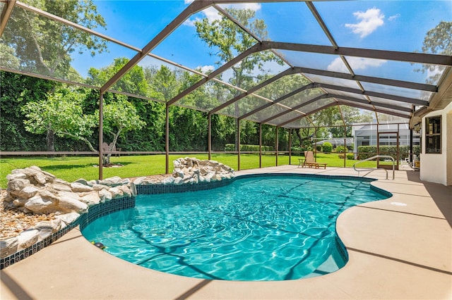 view of swimming pool featuring glass enclosure, a patio area, and a yard