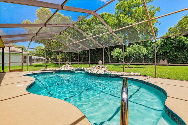 view of swimming pool with a lanai, a patio area, and a yard