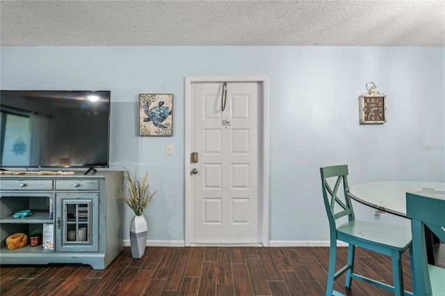 dining space featuring a textured ceiling