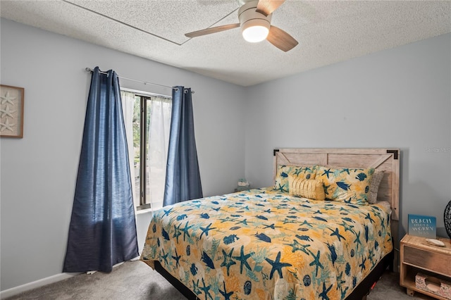 bedroom with carpet, a textured ceiling, and ceiling fan