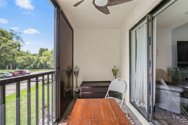 balcony featuring ceiling fan