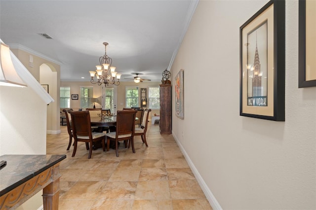 dining room featuring ceiling fan with notable chandelier and ornamental molding