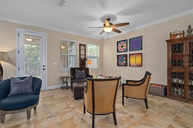 living area with crown molding and ceiling fan