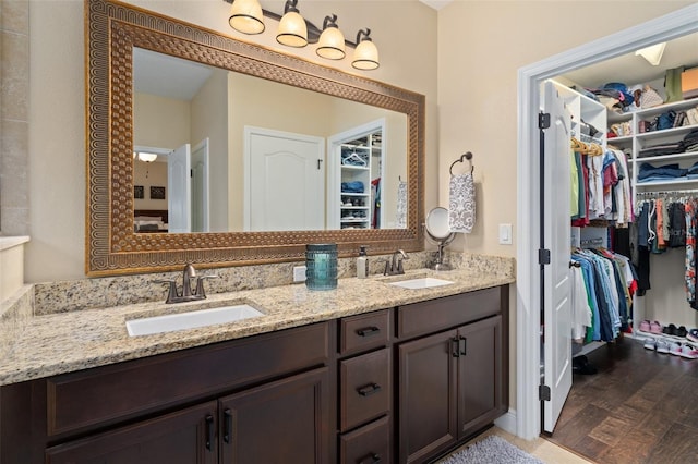 bathroom featuring vanity and hardwood / wood-style flooring