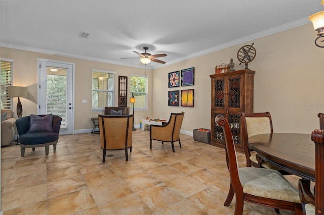 dining room with ceiling fan and ornamental molding