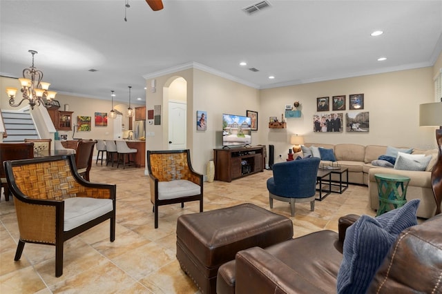 living room featuring crown molding and ceiling fan with notable chandelier