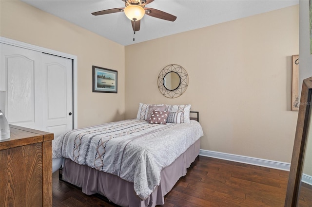 bedroom featuring dark hardwood / wood-style floors, a closet, and ceiling fan